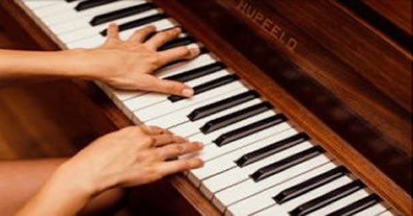 Image of someone playing the piano